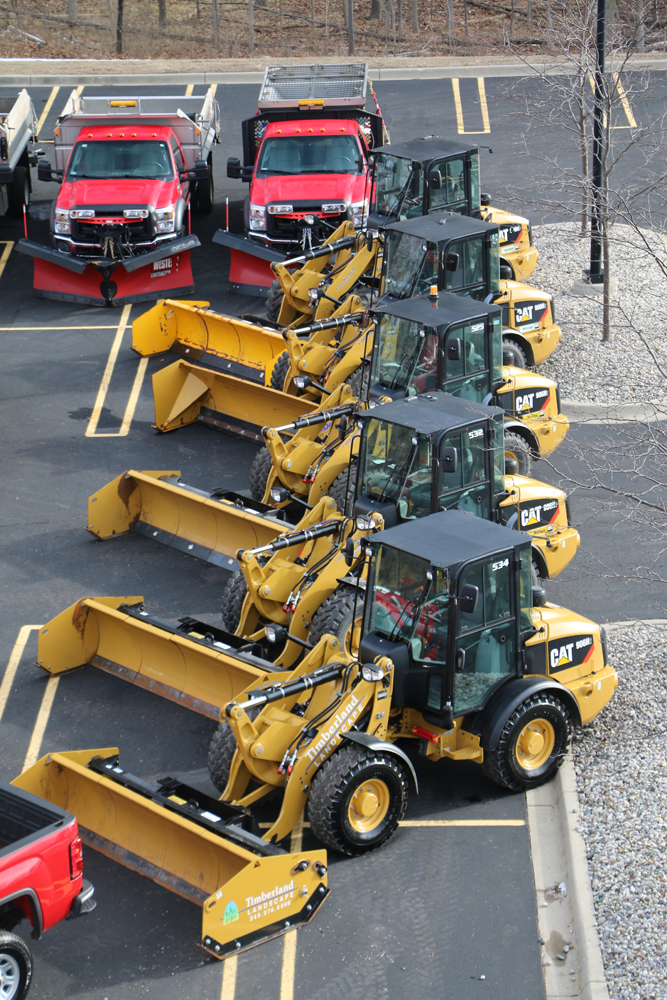 Photo of multiple plows used by Timberland Landscaping
